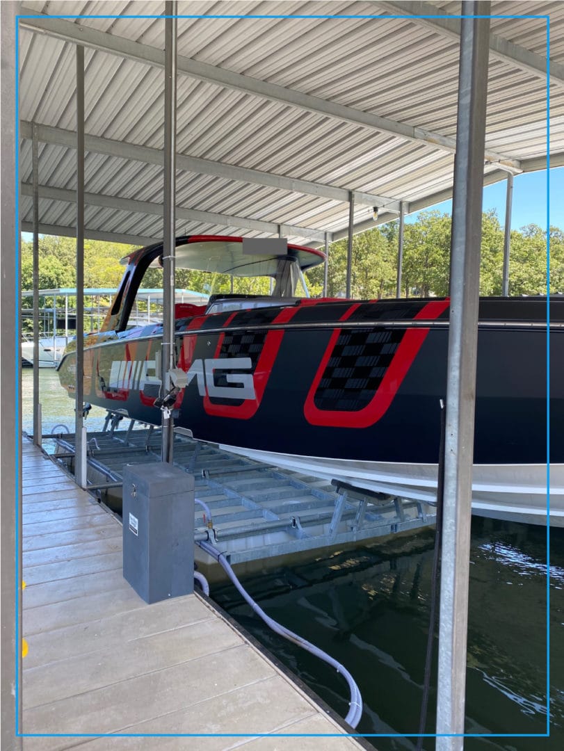 A high-performance boat raised on the Econo Lift Meridian 20,000 lb side mount lift