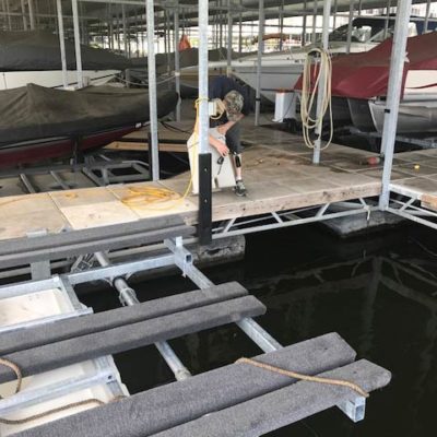 Employee working on a an Econo boat lift installation.